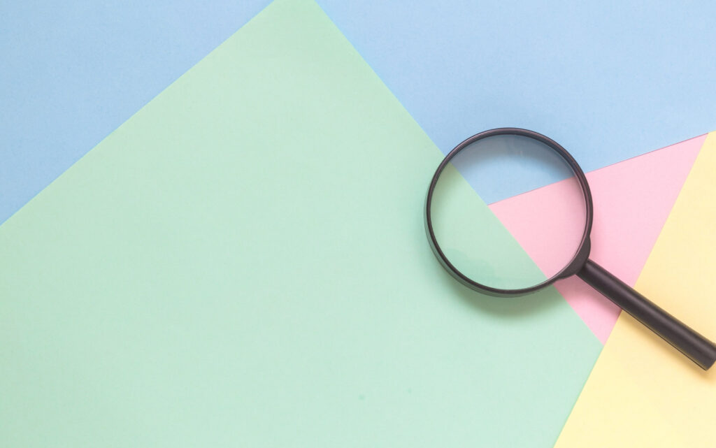 magnifying glass on colored paper to show vision