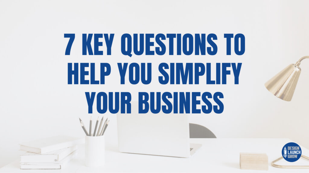 desk with laptop and words 7 key questions to help you simplify your business